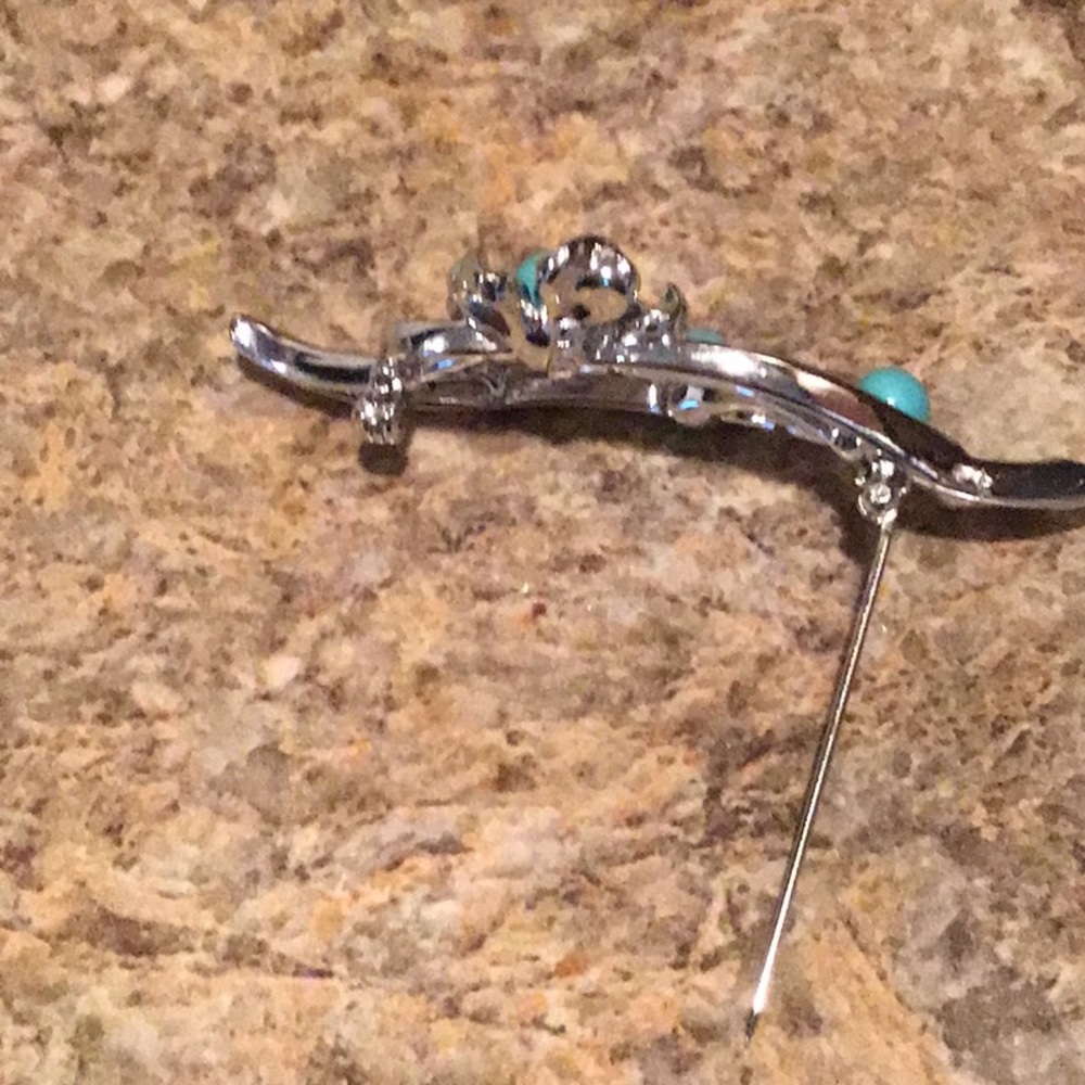 Costume jewelry / Brooch with turquoise stones